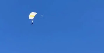 VIDEO: Groom skydives into his wedding