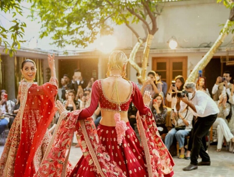 Unmasked model tests positive for COVID-19 days after walking the ramp