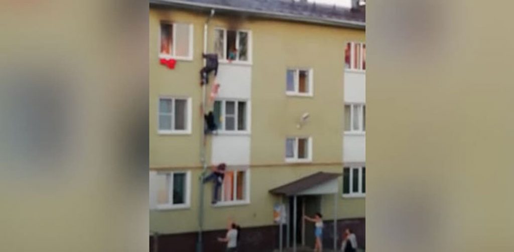 VIDEO: Men climb up drain pipe to save kids from fire