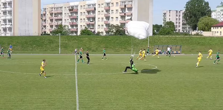 VIDEO: Parachutist lands on pitch during soccer match