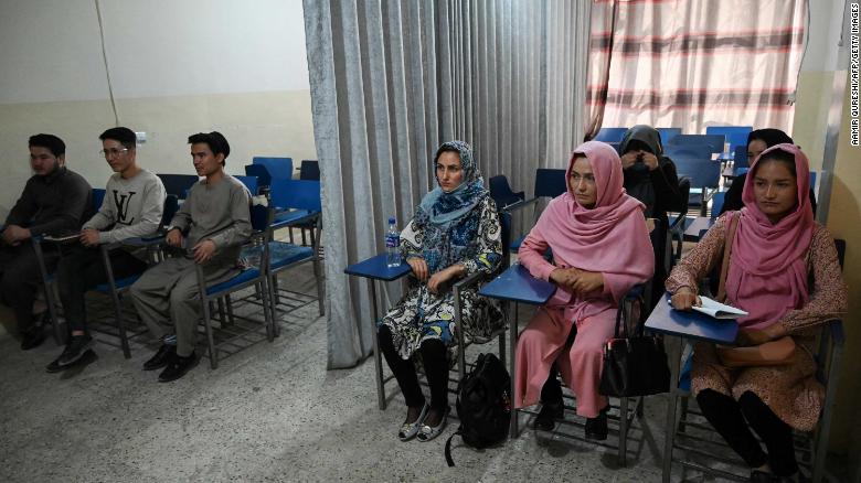 Curtain divides male and female students as Afghan universities reopen