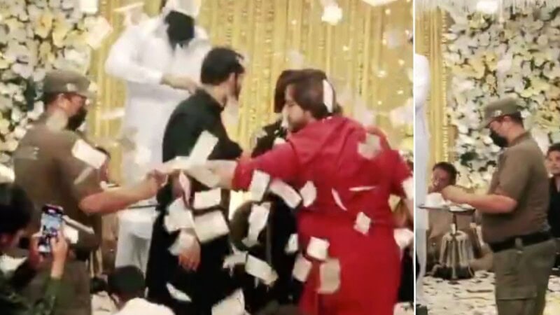 Police official holding tray of cash for TikToker sparks furious debate