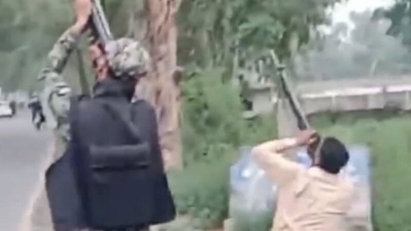 Who is the young man seen in the iconic photo shooting down a drone?